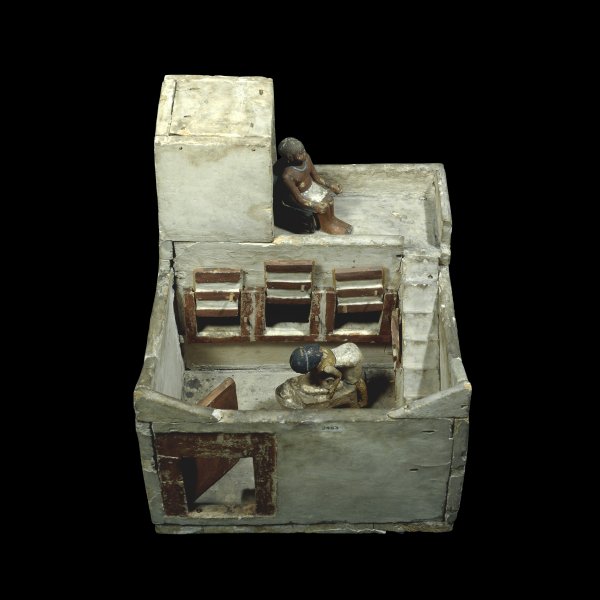 Wooden model of a granary with figures