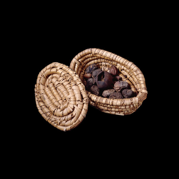 Oval lidded basket of figs and dates